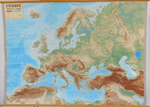 A Mid Century map of Europe, scale 1:3000000, with raised sections denoting mountains, etc, 240cm wi