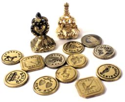 A group of seal stamps, and two seals, comprising a yellow metal and green agate set seal bearing th