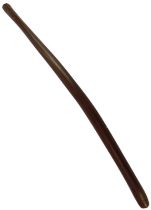 An aboriginal hardwood nulla nulla or club, of cylindrical curved form, possibly 1960s, 68cm long. P