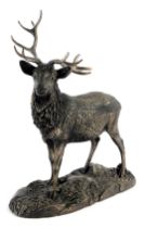A bronzed resin model of a stag, on naturalistic base, signed Tom Mackie, 25cm high.