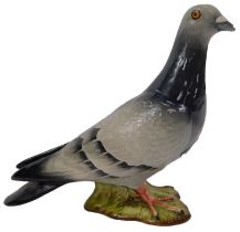 A Beswick pottery figure modelled as a pigeon, 1385, impressed marks to underside, 14cm high.