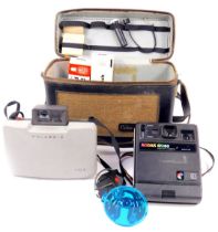 A Polaroid 104 land camera, with box and accessories, and a Kodak EK160 instant camera. (2)