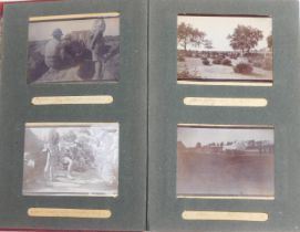 A photograph album containing early 20thC photographs in India, to include figures with guns before