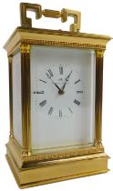A 20thC brass carriage clock, the square enamel dial bearing Roman numerals for Matthew Norman, elev