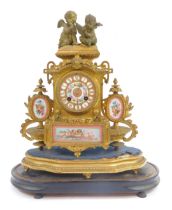 A 19thC French gilt metal mantel clock, the circular enamel dial bearing Roman numerals and decorate