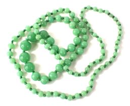 A jadeite graduated beaded necklace, the largest bead 10mm wide, the smallest 2mm wide, on a knotted