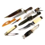 Sheath knives and skinning knife, including a sheath knife with composite handle and alloy pommel an