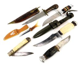 Sheath knives and skinning knife, including a sheath knife with composite handle and alloy pommel an