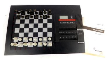 A Radio Shack Master 2200X chess computer, 60-2213, with owners manual and charging cable.