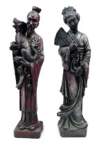 Two painted composition garden statues, in Oriental style modelled as a lady holding fan and gentlem