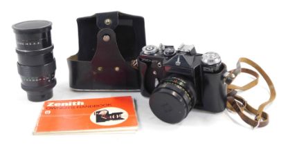 A Zenit EM camera, in case, together with a Pentacon 2.8-135 lens.