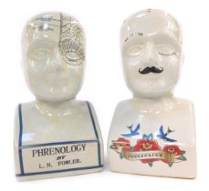 Two pottery phrenology heads, one decorated with floral and bird motifs, 19cm high, the other by LM