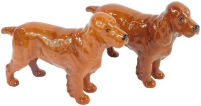 Two Beswick pottery dog figures, modelled as Cocker Spaniels, each 14cm high.