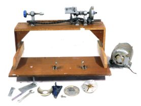 A lathe, on wooden stand, 75cm wide.