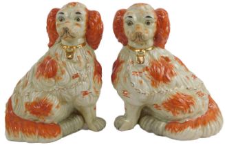 A pair of large Staffordshire type comforter dogs, modelled as Spaniels, each with a gilt collar and