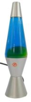 A Lava Lite lava lamp, in green and blue, on metal base of waisted form, 37cm high overall.