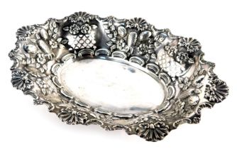 A Victorian silver dish, of oval shaped form, embossed with shells, foliate motifs, fruit to include