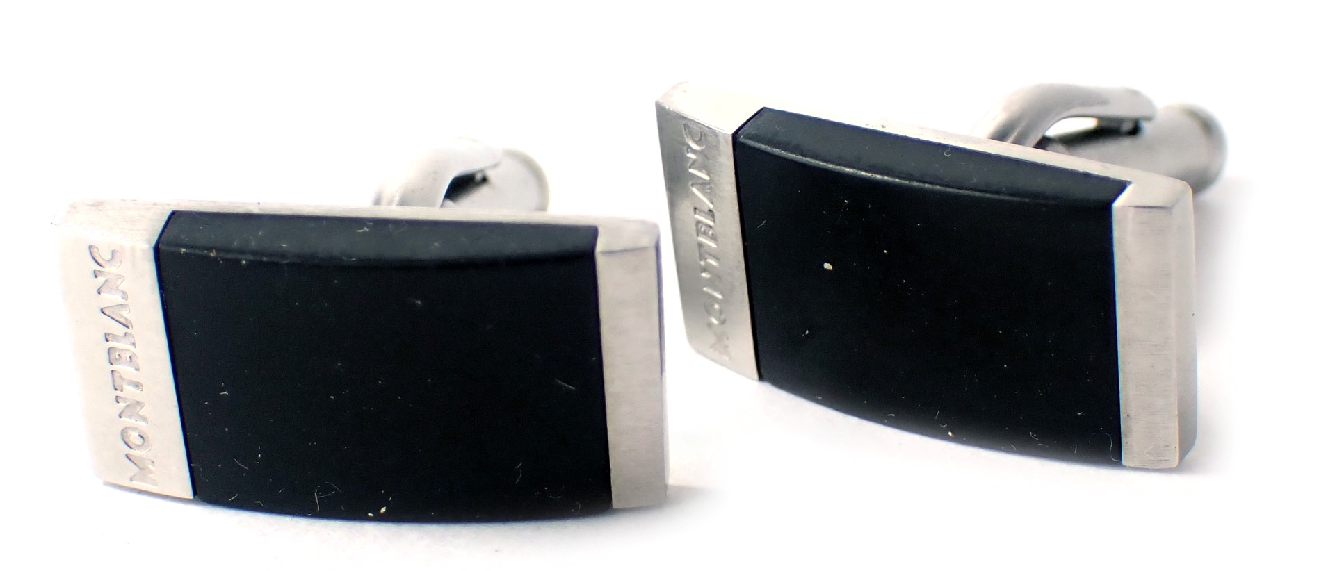A pair of Mont Blanc gentleman's cufflinks, each with a rubber black design, on stainless steel back