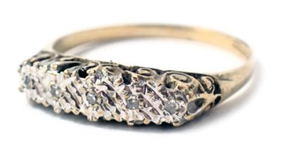 A 9ct gold dress ring, of half hoop design set with tiny diamonds, in brush white gold setting with