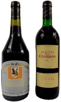 A bottle of Domaine du Grand Chene 1990 Cairanne wine, together with a bottle of Domaine du Charron