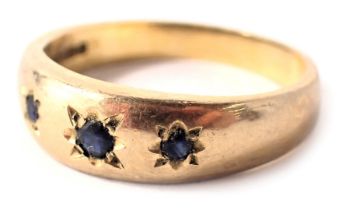A 9ct gold half hoop dress ring, set with three illusion set sapphires, each in star setting, ring s