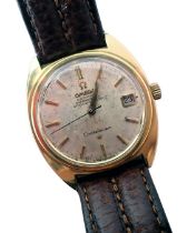 An Omega Constellation wristwatch, with a silvered dial and date aperture, with automatic movement,
