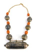 An Eastern Prayer necklace, the knotted string strand with applied bulbous design, with butterscotch