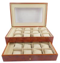 A 20thC yew cased jewellery box, the top inset with a rectangular plastic panel, the hinge lid enclo