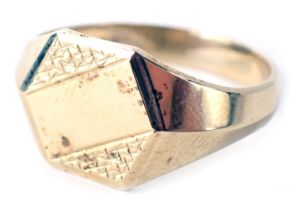 A 9ct gold signet ring, the ring head of hexagonal form with vacant central shield and hammered oute
