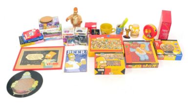 A group of The Simpsons memorabilia, to include jigsaw puzzles, Ortved (John) The Simpons An Uncenso