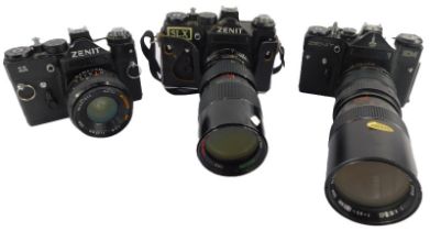 Three Zenit cameras, to include an EM with Olympic emblem, and 11, and an SLX, all with lenses.