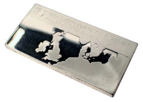A silver ingot, inscribed United Kingdom of Great Britain and Northern Ireland, with map to once sid