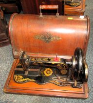 A cased Singer sewing machine.