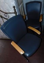 A set of two metal framed office chairs, with leatherette upholstered seat and back, in grey. The u