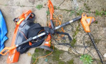 A Flymo electric garden vac, together with strimmer, and a hedge trimmer. (3)