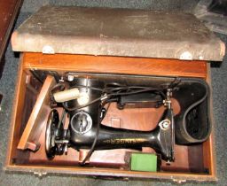 A cased Singer sewing machine.