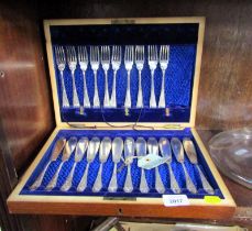 A mahogany cased canteen containing fish knives and forks.