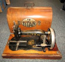 A cased Titan sewing machine.