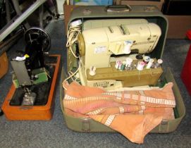 A Singer sewing machine, lacking outer case, together with a cased Bernina Record sewing machine (AF