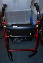 A mobility walker, in red trim.