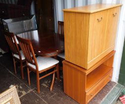 A Morris Company mahogany extending dining table, rectangular top with a rounded edge above twin ped