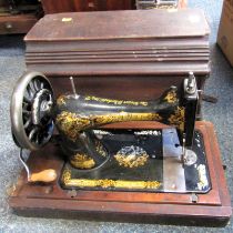 A cased Singer sewing machine.