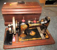 A cased Jones sewing machine.