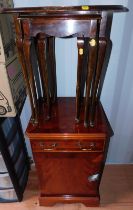 A nest of three mahogany and flame mahogany tables, together with a mahogany cabinet. (2)