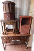 A group of furniture, to include an oak dressing table, oak nest of three tables, wicker side cabine