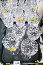 A set of six cut glass wine glasses, together with four further glasses.