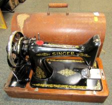 A cased Singer sewing machine.