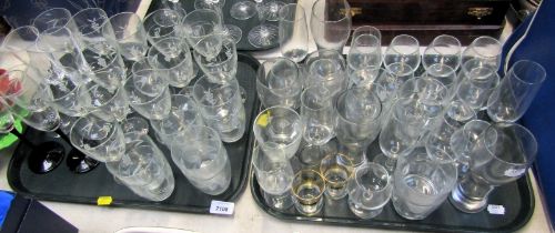 A group of drinking glasses, to include tumblers, wine glasses, champagne flutes, etc. (2 trays)