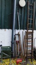 A wooden A frame ladder, together with a further ladder, folding camping chair, various garden tools