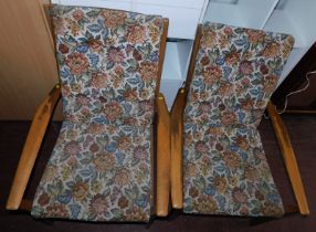 A pair of Cintique open armchairs, with floral upholstered seat and back. The upholstery in this lot